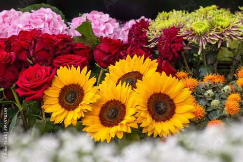 Sunflowers and roses in a bouquet at a flower shop