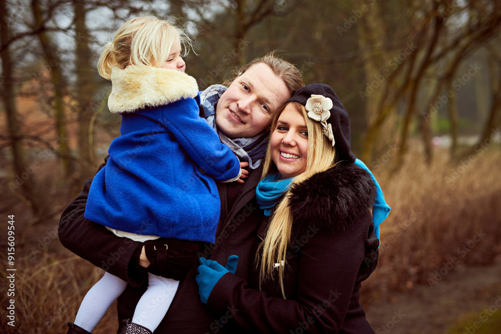 Fototapeta premium Winter, portrait and parents in park with child and happiness for outdoor fun, love and bonding together. Happy family, mother and proud father in nature with girl, daughter and smile in cold weather