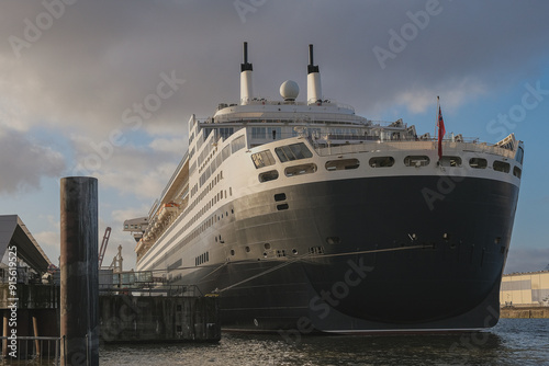 Legendary luxury ocean liner Queen Mary 2 cruiseship cruise ship at Steinwerder terminal in Hamburg port, Germany on sunny day photo