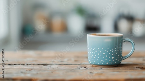 Blue Polka Dot Mug on Wooden Table in Cozy Cafe With Blurred Background