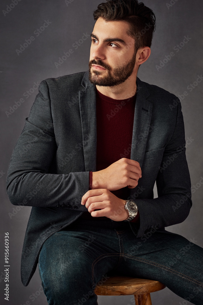 Man, thinking or stylish in studio for fashion, confidence or mysterious aesthetic. Gentleman, designer clothing or day dream on dark background with luxury watch, expensive taste or sitting on chair Man, thinking or stylish in studio for fashion, confidence or mysterious aesthetic. Gentleman, designer clothing or day dream on dark background with luxury watch, expensive taste or sitting on chair