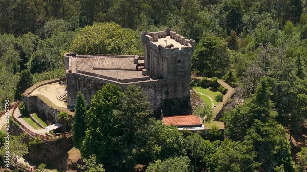 Drone shot of medieval Sobroso Castle surrounded by forests and hills in Vilasobroso, Galicia, Spain Drone shot of medieval Sobroso Castle surrounded by forests and hills in Vilasobroso, Galicia, Spain