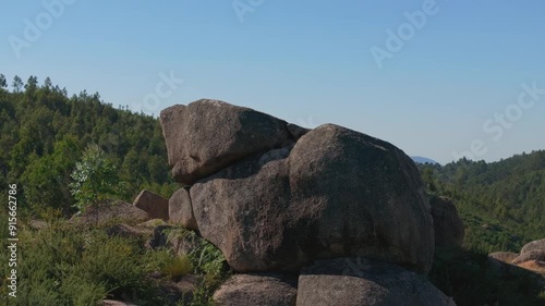 Recending drone shot of rock boulders near Ponteareas, Galicia, Spain. photo