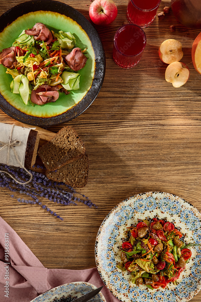 Fresh Salad Plates on a Wooden Table with Vegetables and Fruits Fresh Salad Plates on a Wooden Table with Vegetables and Fruits