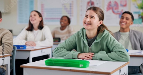 Happy, student and listening to lesson in classroom, high school and smile for education of biology. Group, teenager and girl with knowledge of science, paper and preparing for exam and classmates