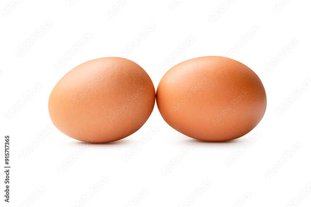 Side view of two fresh brown chicken eggs in stack isolated on white background with clipping path Side view of two fresh brown chicken eggs in stack isolated on white background with clipping path