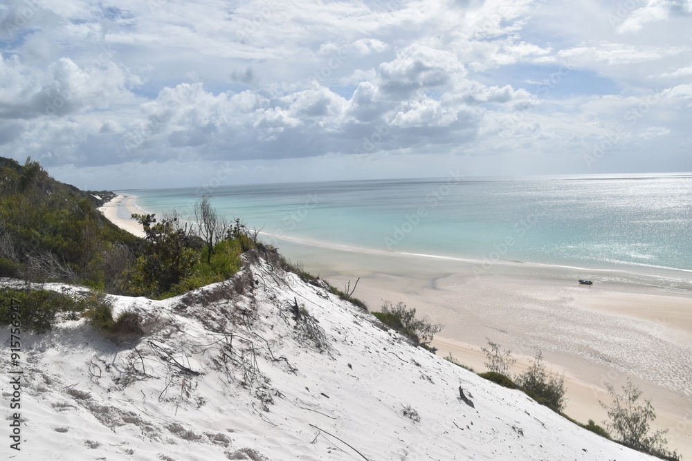 Sailing on the crystal clear turqoise blue water around the white sand beaches of Fraser Island in Queensland, Australia Sailing on the crystal clear turqoise blue water around the white sand beaches of Fraser Island in Queensland, Australia