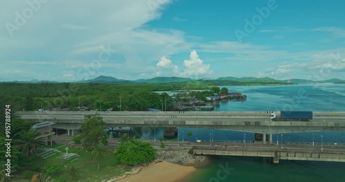 Wallpaper Mural Aerial view beautiful Sarasin bridge on the blue sea.
Sarasin bridge is important route connecting by land.
Scene of white cloud in blue sky and green sea.
the bridge connect Phuket to Phang Nga. Torontodigital.ca
