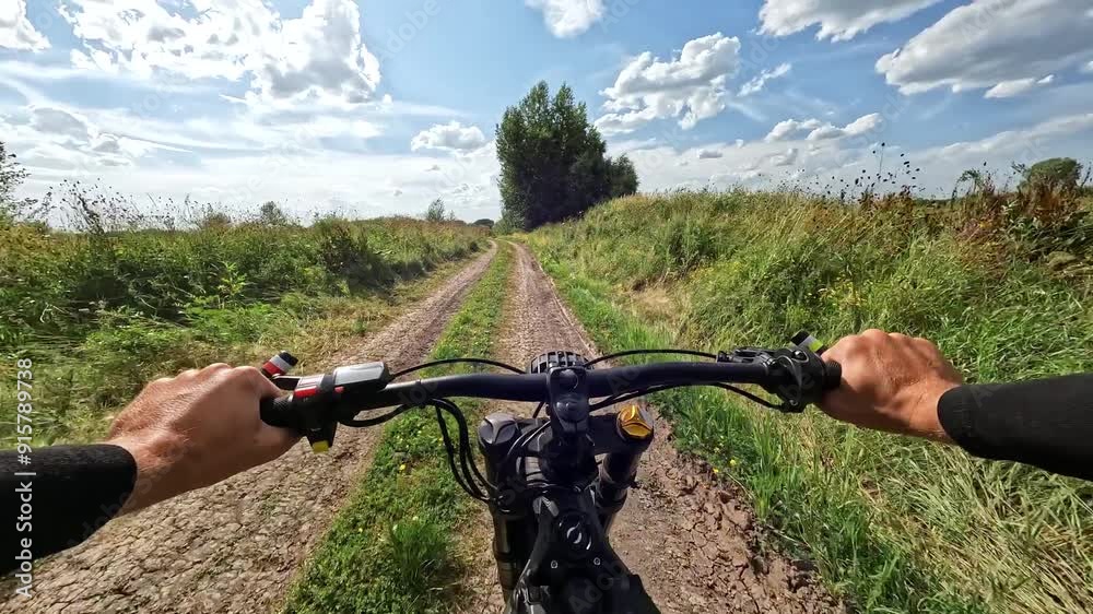 POV Electric Bike Riding on a Field Country Road surrounded by Bushes and tall Grass at Summer Day. 60 fps, H.264, 8bit, Chroma Subsamlping 4:4:4 POV Electric Bike Riding on a Field Country Road surrounded by Bushes and tall Grass at Summer Day. 60 fps, H.264, 8bit, Chroma Subsamlping 4:4:4
