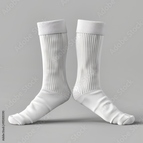 Elegant white socks displayed on a soft gray background with a minimalistic aesthetic focusing on texture and design