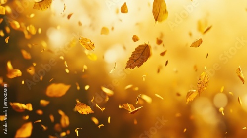 Golden Autumn Leaves Falling in the Air with Warm Sunset Glow - A Beautiful Abstract of Nature's Tranquility