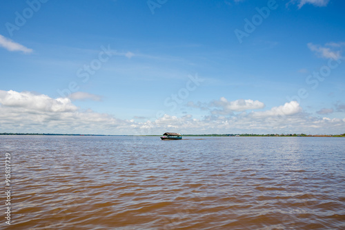 Navigating the Amazon River. In the Amazon jungle, near Iquitos, Peru. South America. photo