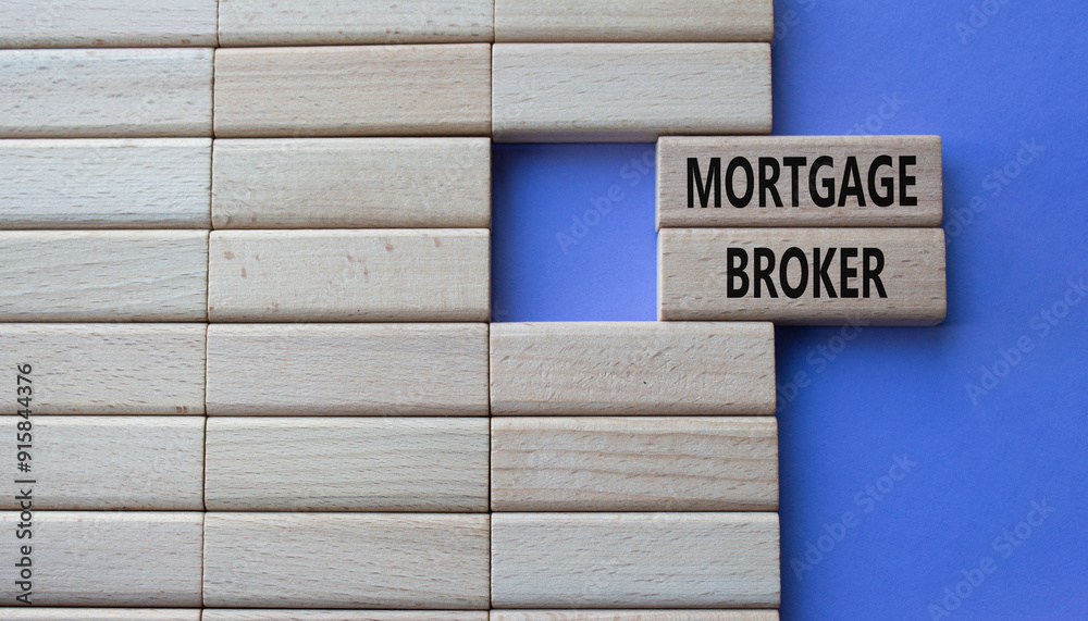 Mortgage Broker symbol. Concept word Mortgage Broker on wooden blocks. Beautiful purple background. Business and Mortgage Broker concept. Copy space Mortgage Broker symbol. Concept word Mortgage Broker on wooden blocks. Beautiful purple background. Business and Mortgage Broker concept. Copy space