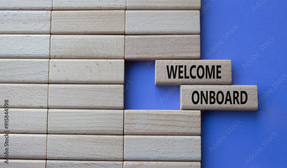 Welcome onboard symbol. Concept words Welcome onboard on wooden blocks. Beautiful purple background. Business and Welcome onboard concept. Copy space. Welcome onboard symbol. Concept words Welcome onboard on wooden blocks. Beautiful purple background. Business and Welcome onboard concept. Copy space.