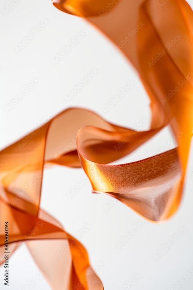 A close-up of a gymnast's ribbon as it twirls and curls in the air during a routine A close-up of a gymnast's ribbon as it twirls and curls in the air during a routine