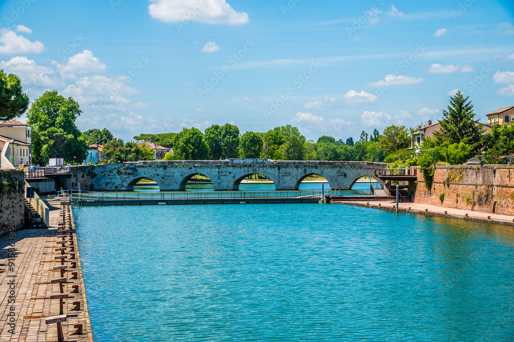Obraz premium A view along the estuary out to sea at Rimini, Italy in summertime