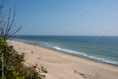 several people enjoy an ocean side beach in cape cod Massachusetts