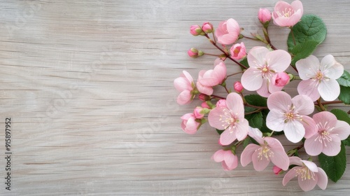 Delicate Pink Blossoms Laid on Rustic Wooden Surface in Soft Natural Light