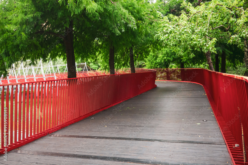 red bridge in Maple Garden park in Taichung City, Taiwan red bridge in Maple Garden park in Taichung City, Taiwan