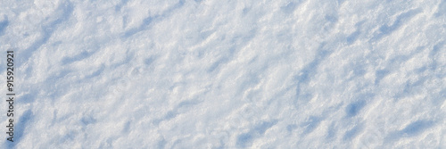Obraz na płótnie Natural snow texture. The surface of the snow crust. Snowy ground. Winter background with snow patterns. Perfect for Christmas and New Year design. Closeup top view. w salonie