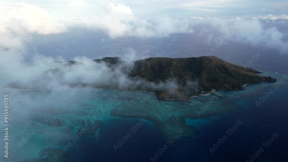 Aerial view above Tavewa Island in the Yasawa Islands Fiji at sunrise - Tropical paradise Island in the south Pacific Aerial view above Tavewa Island in the Yasawa Islands Fiji at sunrise - Tropical paradise Island in the south Pacific