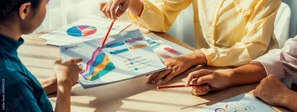 Obraz premium Startup company employee working together, analyzing BI dashboard paper on financial data report and planning strategic marketing for business success in panorama banner. Synergic
