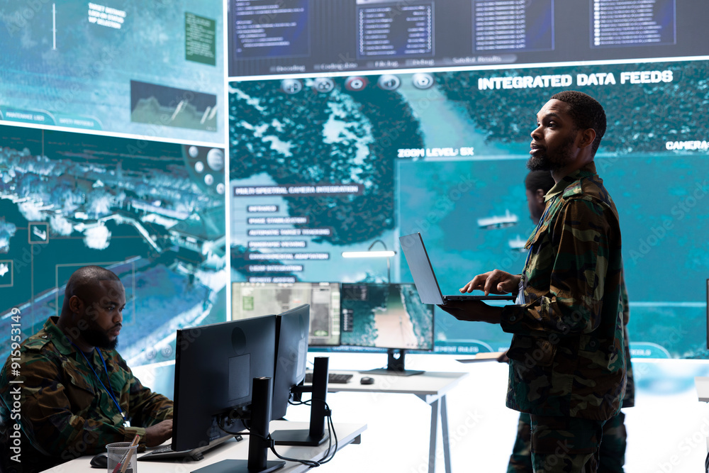 Military control room features army personnel monitoring surveillance systems, soldiers integrating data and coordinating strategic missions. Support decision making and efficiency. Military control room features army personnel monitoring surveillance systems, soldiers integrating data and coordinating strategic missions. Support decision making and efficiency.