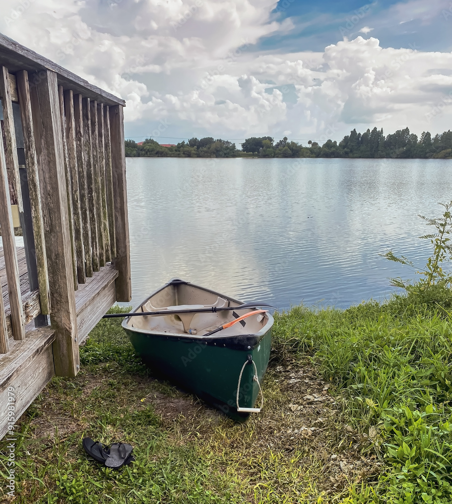 Green canoe by fishing platform, Lake, Tampa Florida Green canoe by fishing platform, Lake, Tampa Florida