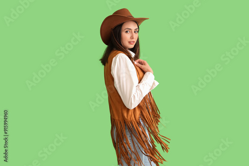 Beautiful cowgirl on green ...