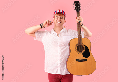 Male hippie with guitar sho...