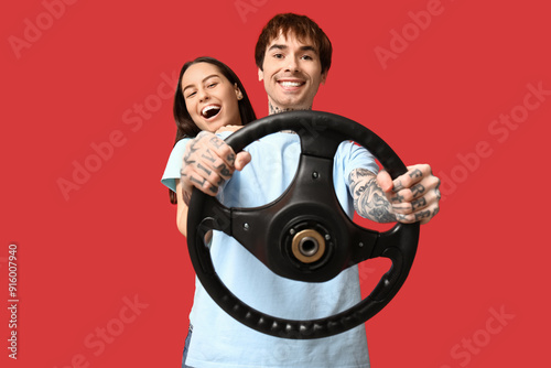 Young couple with steering ...