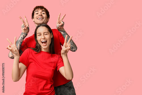 Happy young couple showing ...