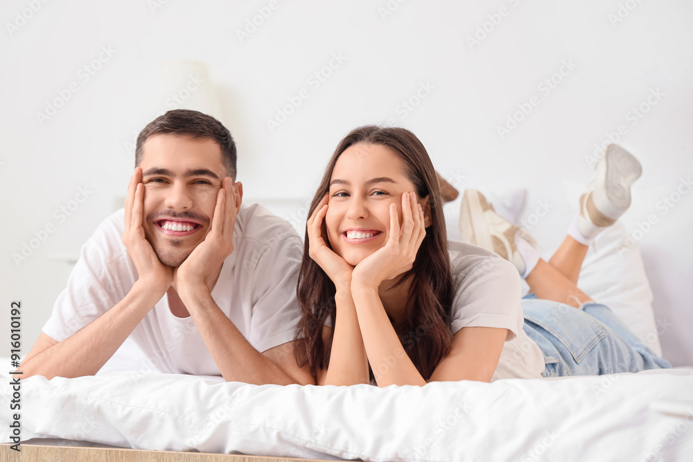 Happy young couple in bedroom Happy young couple in bedroom