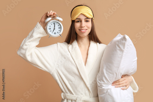 Young woman in pajamas and ...