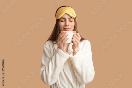 Young woman in pajamas and ...