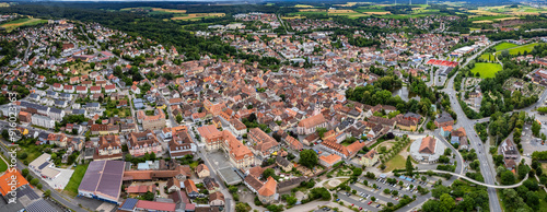 Aerial view around the old town of the city Neustadt an der Aisch on a cloudy day in Germany. 