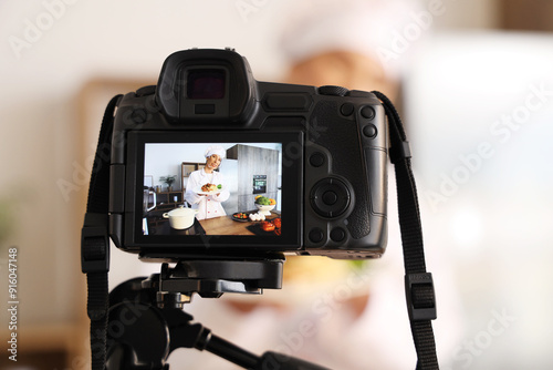 Female food blogger with ta...