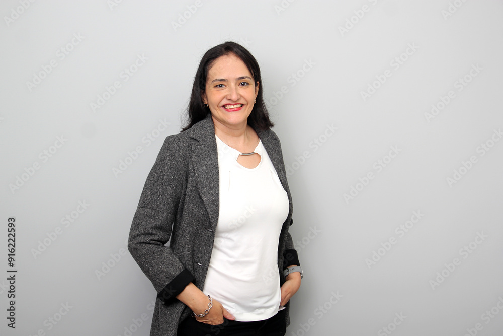 Latin adult 40 years old woman in executive portrait works in office as business leader Latin adult 40 years old woman in executive portrait works in office as business leader