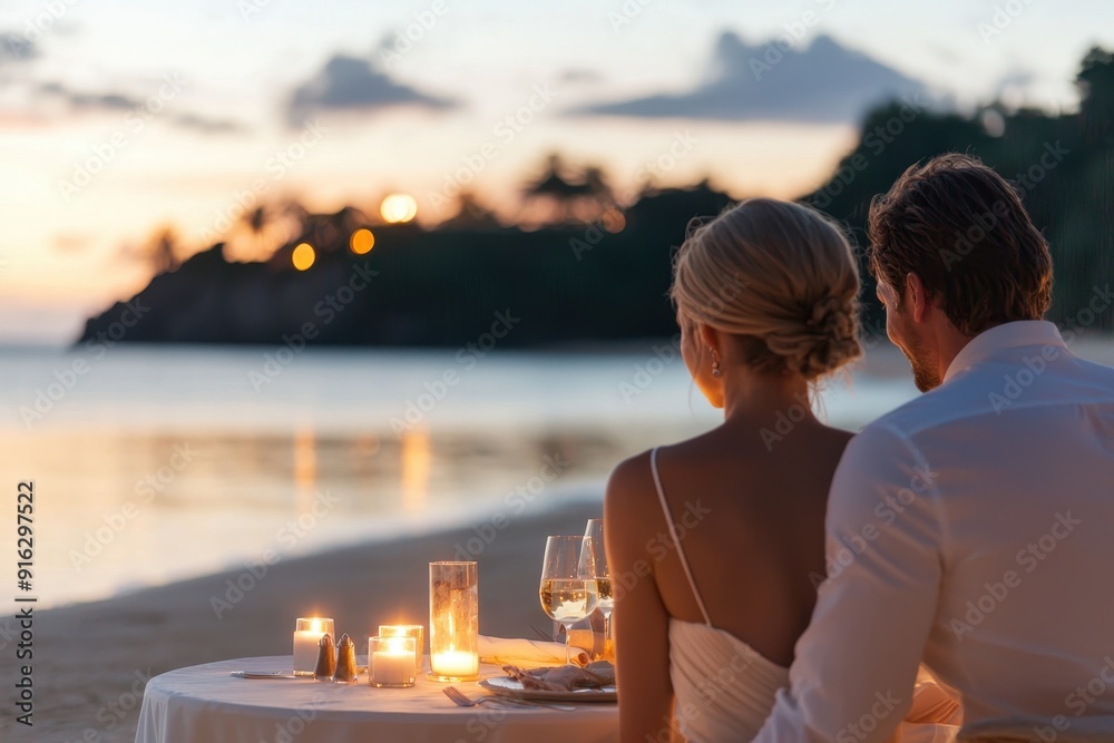 Obraz premium Romance by the Sea: Elegant Couple Enjoying Candlelit Dinner on Private Beach