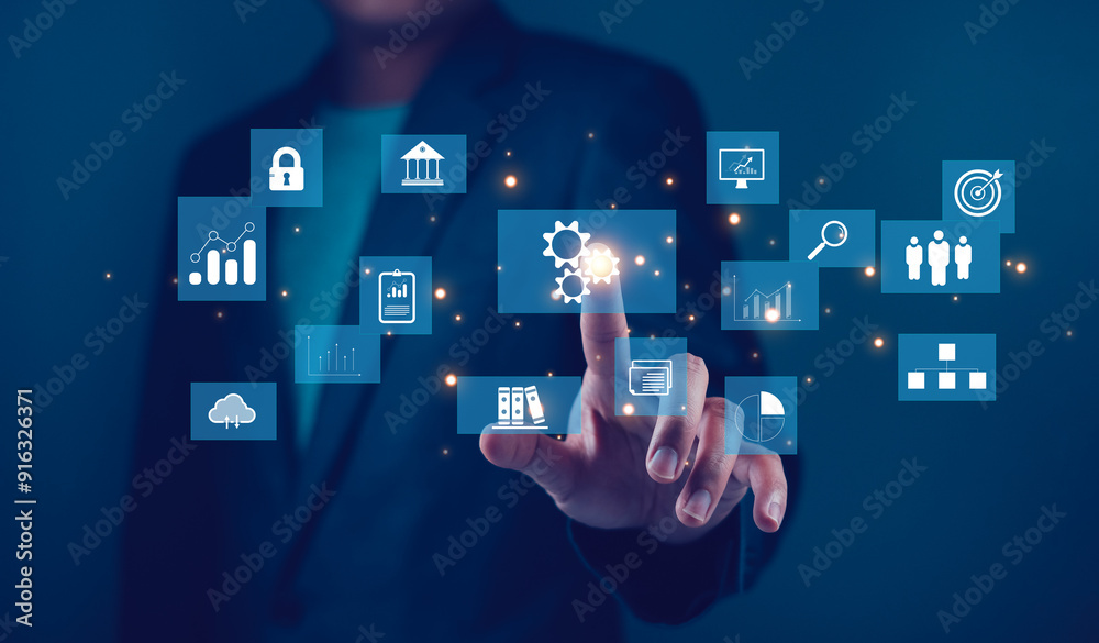 Businessman interacting with digital interface icons for data analytics and technology. Conceptual technology and innovation Businessman interacting with digital interface icons for data analytics and technology. Conceptual technology and innovation