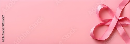 Pink ribbon for breast cancer awareness. Mammography Day. Horizontal banner. Pink ribbon on a pink background. Free space for text Breast cancer prevention screening Hardware examination of the breast