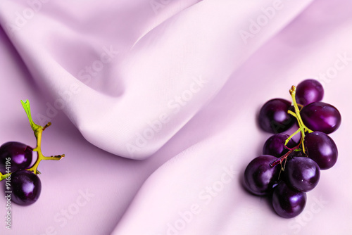 Elegant Product Background with Purple Satin Fabric and Fresh Grapes for Luxurious Food and Beverage Designs