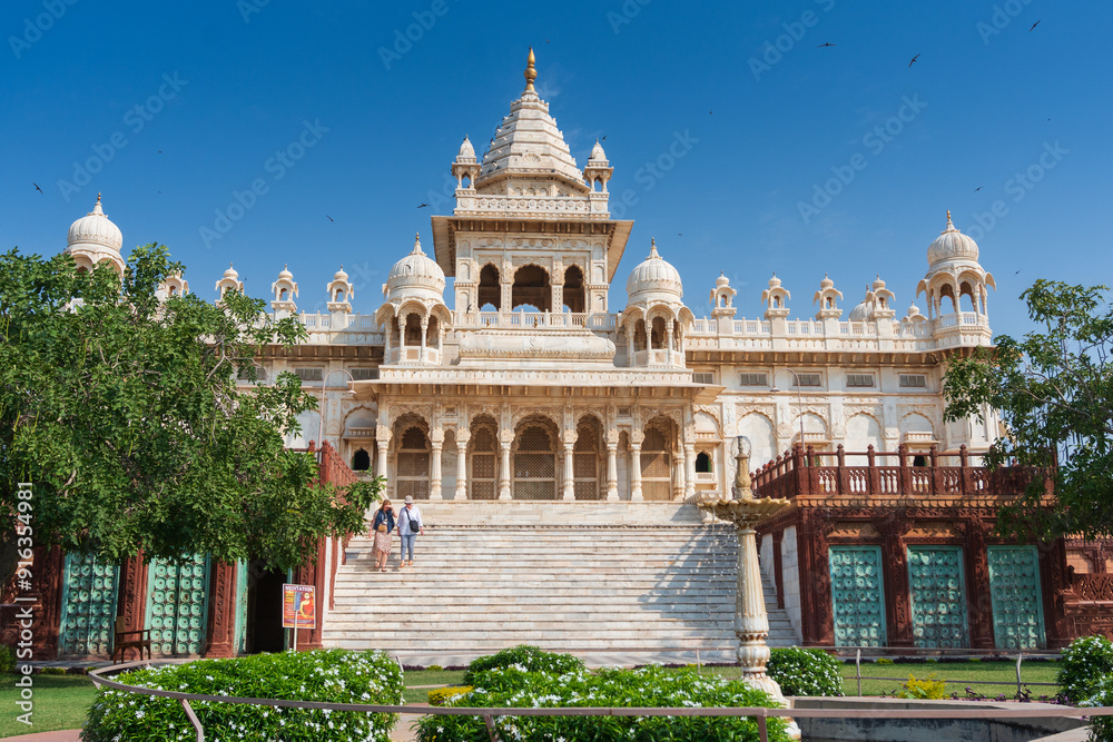 Obraz premium Beautiful view of Jaswant Thada cenotaph, Jodhpur, Rajasthan, India. Built out of intricately carved sheets of Makrana marble, they emit a warm glow when illuminated by the Sun. Blue sky background.