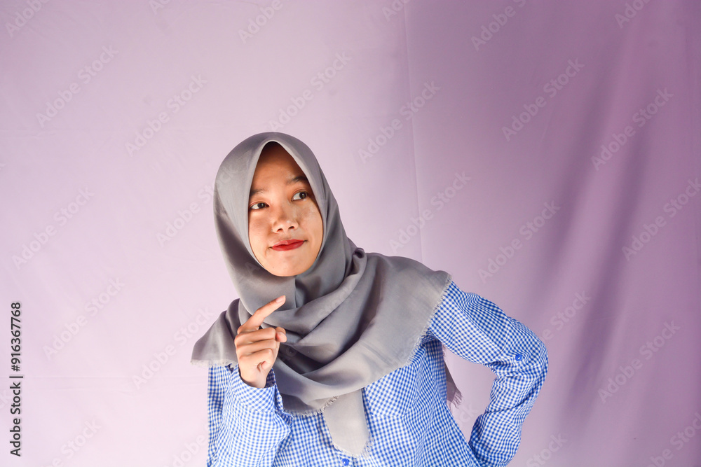 Portrait of a confident Asian woman facing the camera on an isolated background Portrait of a confident Asian woman facing the camera on an isolated background