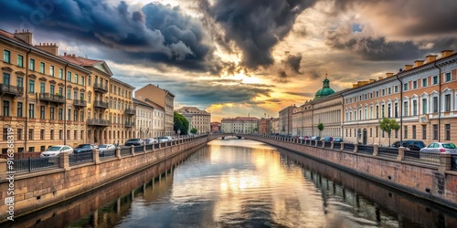 Canal with Moyka river in Saint-Petersburg with dramatic cloudy sky. View from Nevsky Prospect