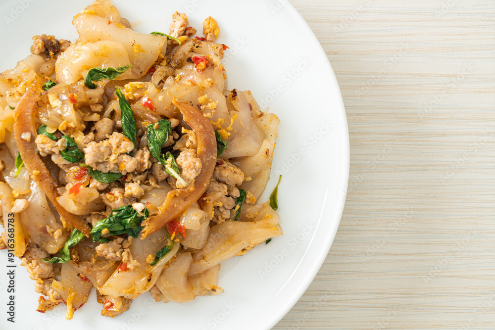 Stir-fried noodle with minced chicken and basil Stir-fried noodle with minced chicken and basil