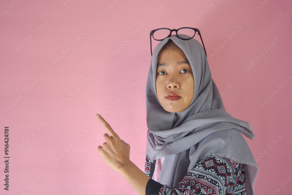 Portrait of a confident Asian woman facing the camera on an isolated background