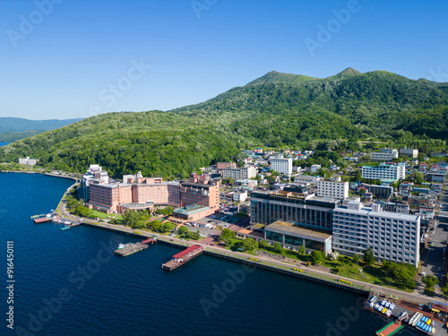 Lake Toya, Hokkaido, Japan: Aerial view of the resort town of Toya Onsen famous for its hot springs and Japanese spa in Hokkaido in summer. photo