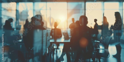 A blurry image of people sitting at a table in an office. AI.