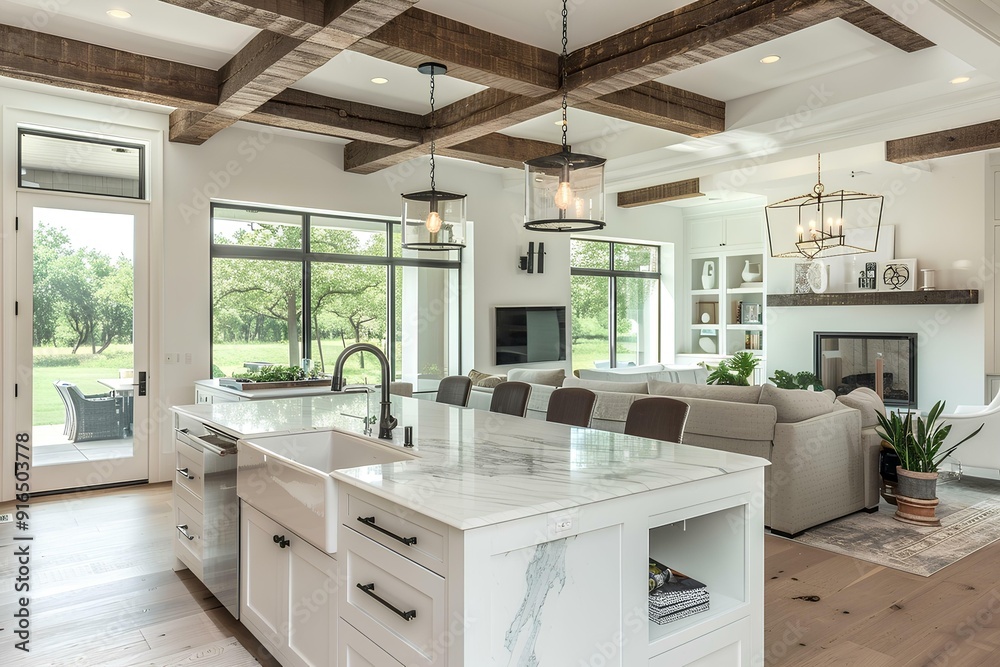 Fototapeta premium Beautiful modern farmhouse open concept kitchen with large center island, white cabinets and wood beams in the ceiling. Marble countertops, stainless steel appliances. Luxury home interior